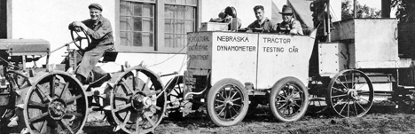 Tractor with three students