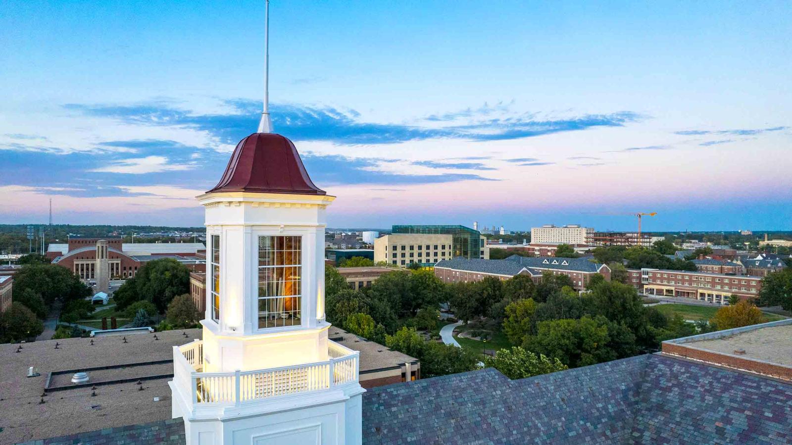 Photo of the cupola at the top of Love Library South with a clear blue sky. Photo by: Craig Chandler, Office of University Communication