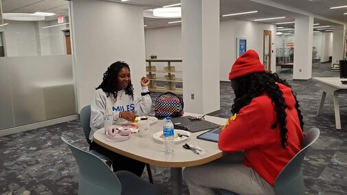 Students eating food from reception