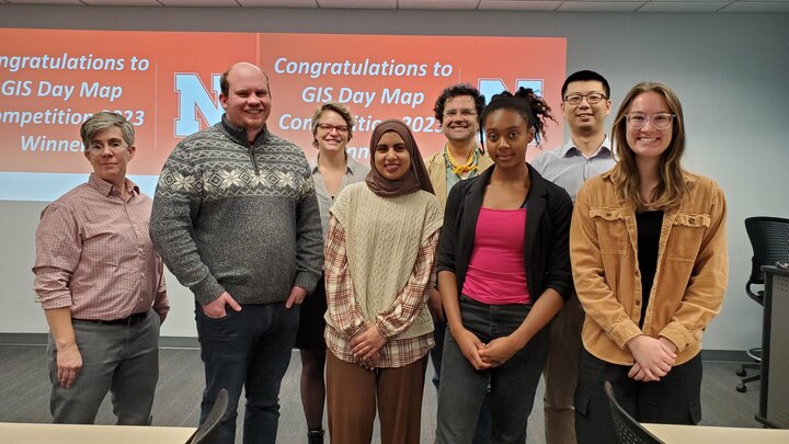 Winners of the GIS Map Competition come together with the judges of the competition to receive their awards.