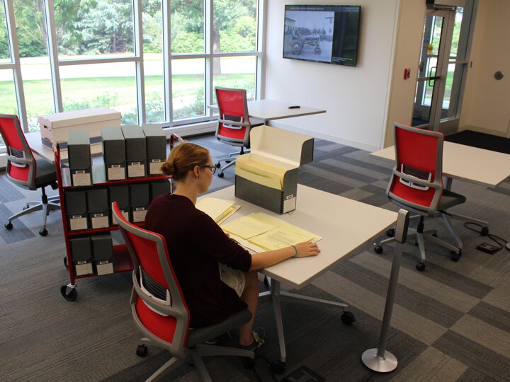 Student looking at materials in the LDRF reading room